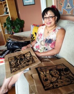 Volunteer Shadi Letson with Project Angel Heart meal bags