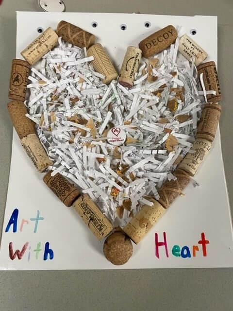 Wine corks in the shape of a heart and shredded paper