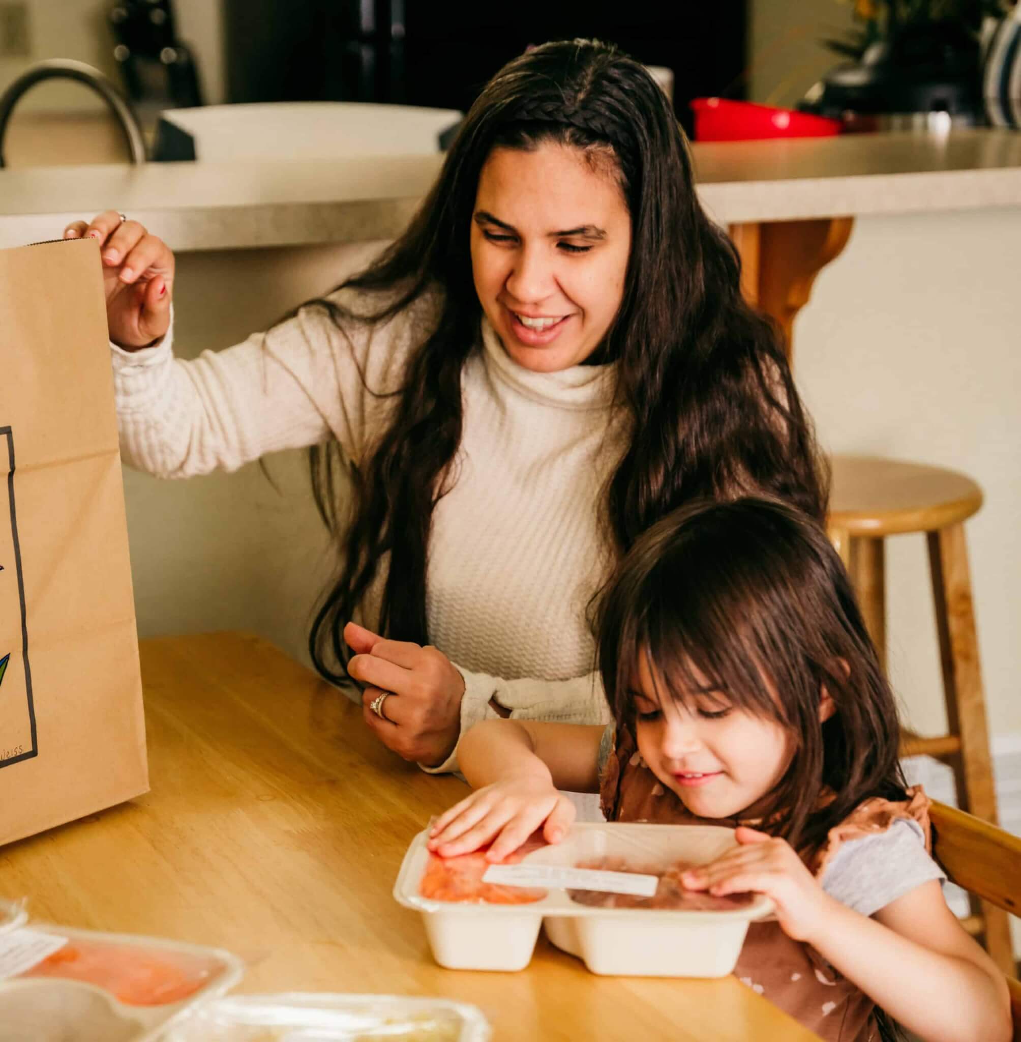 Alyssa and Bella looking at meals