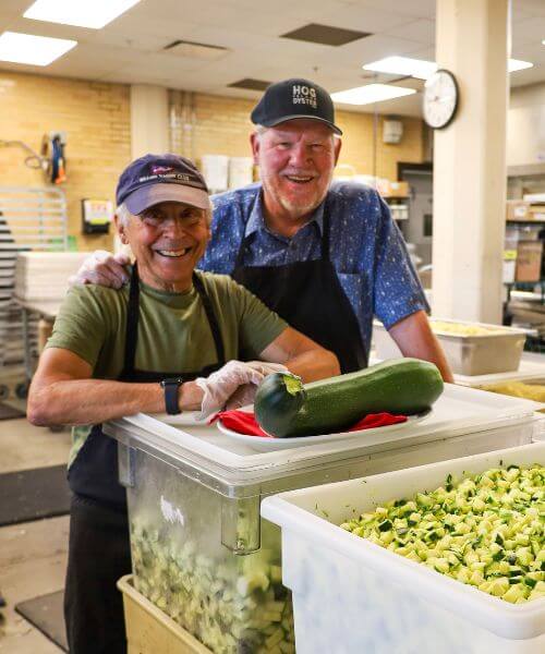 The Zucchini Brothers in front of a zucchini