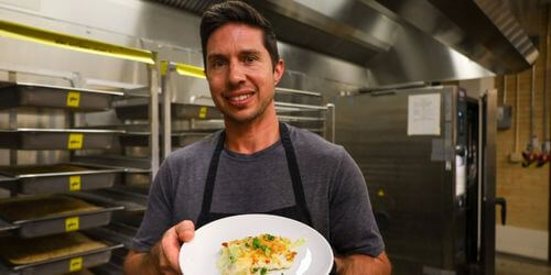 Chef Brett holding leek gratin