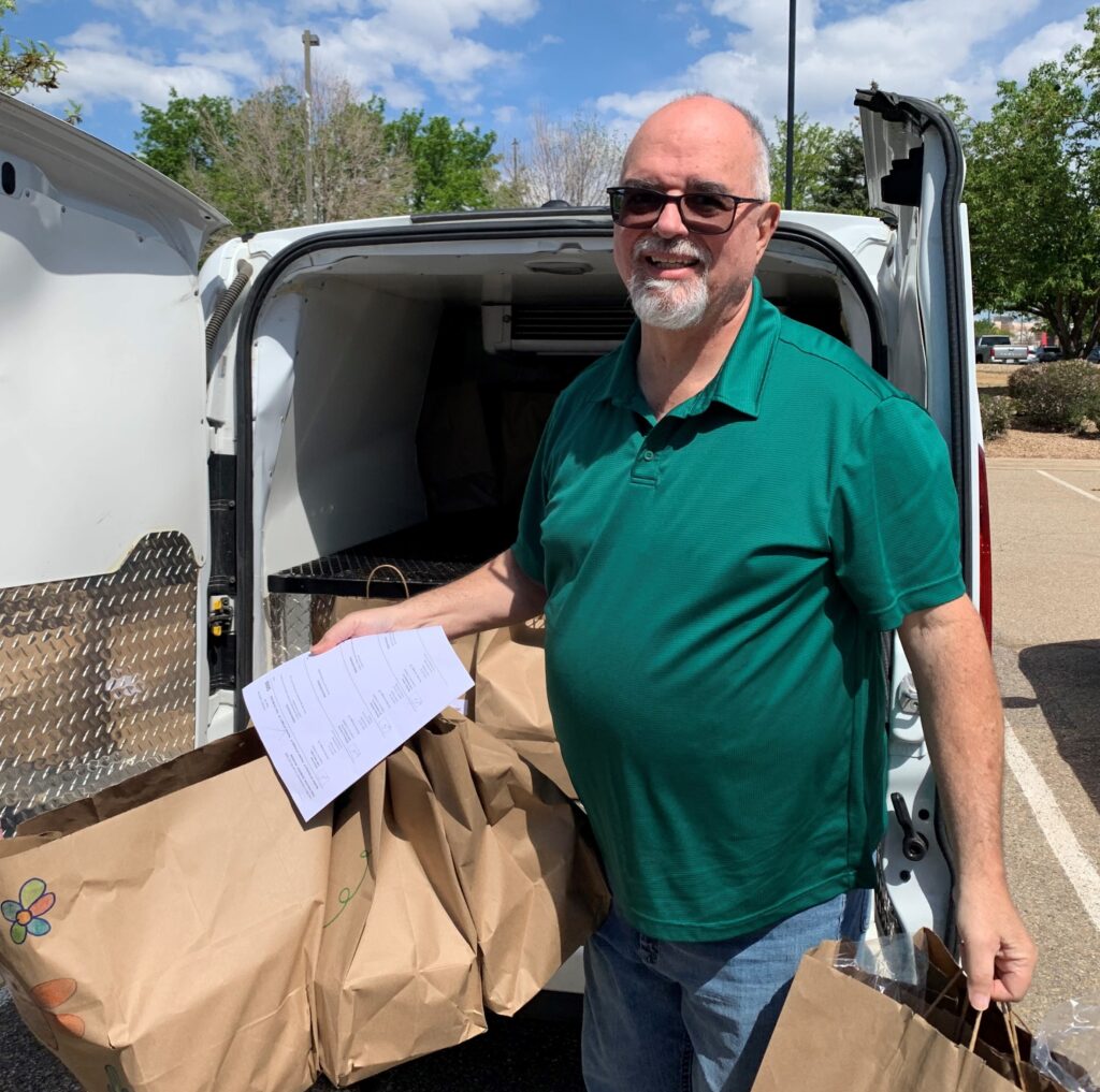 David Finnegan loading meals into a van.