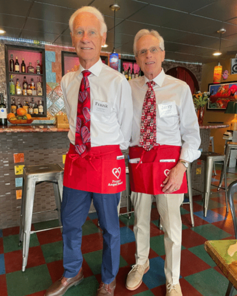 Volunteers Frank and Jerry Gold at a restaurant working as ambassadors for the Dining Out For Life Event.